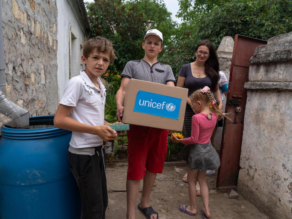 Anastasia, 33, and her children: Andrii, 11, Mykhailo, 13, and Olia, 7 in Mykolaiv, Ukraine, June 16, 2023.