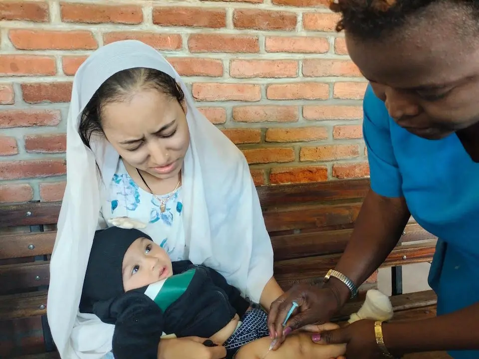 Six-month-old Umar receives his first dose of the malaria vaccine at a UNICEF-supported hospital in Lilongwe, Malawi.
