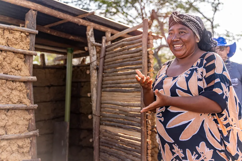 On northern Colombia's La Guajira Peninsula, Leivis Ipuana proudly offers a tour of her new bathroom, improved with support from UNICEF and the Baxter International Foundation..