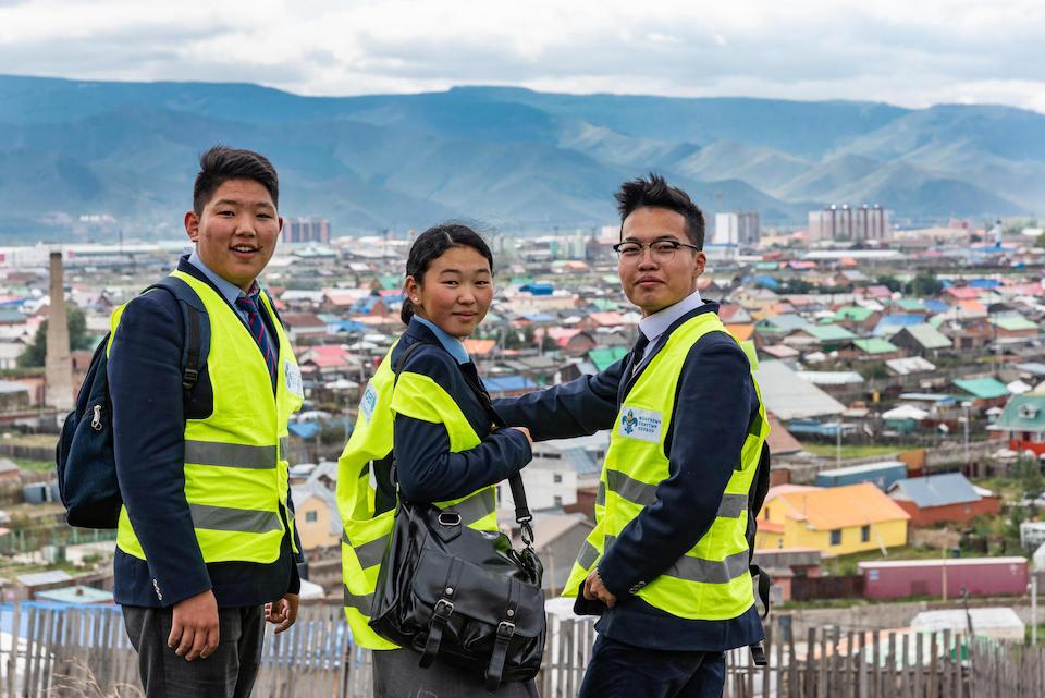Adolescents collect air pollution data in the outskirts of Ulaanbaatar, Mongolia, as part of a UNICEF-supported program that encourages youth engagement in climate action.