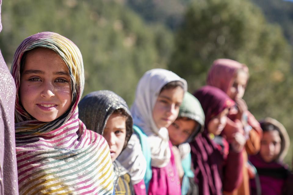 Girls in Afghanistan stand outside their UNICEF-supported community-based school in Spera District, Khost province, Afghanistan.