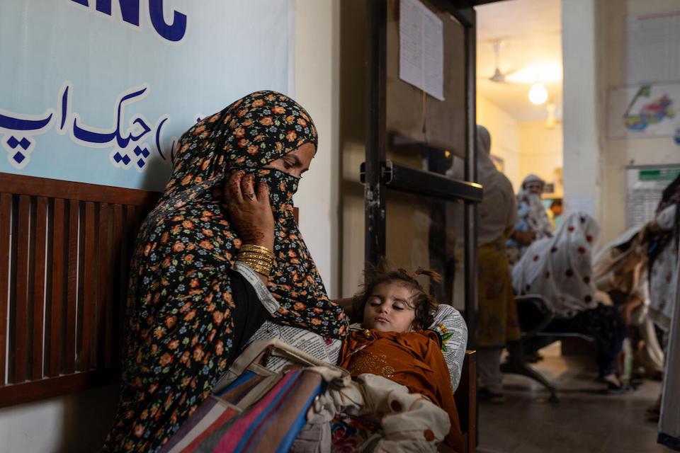 A mother holds her baby at the UNICEF-supported Kotla Isan Health Center in South Punjab province.