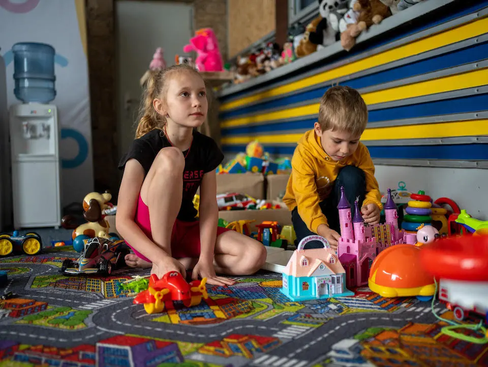 Children play iside a Spilno Child Spot UNICEF helped set up inside a railway station in Mykolaiv, Ukraine, for children displaced by the war.