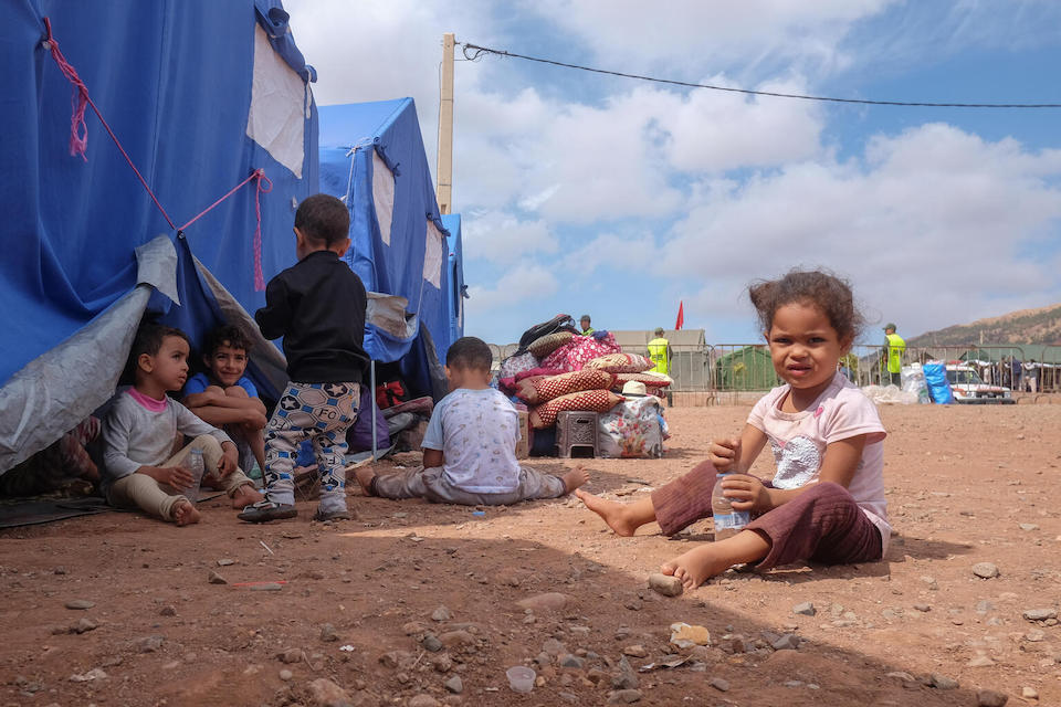 On Sept. 12, 2023 in Asni, Morocco, children play in front of tents provided by the government in a camp for people who lost their houses in the Sept. 8 earthquake. 