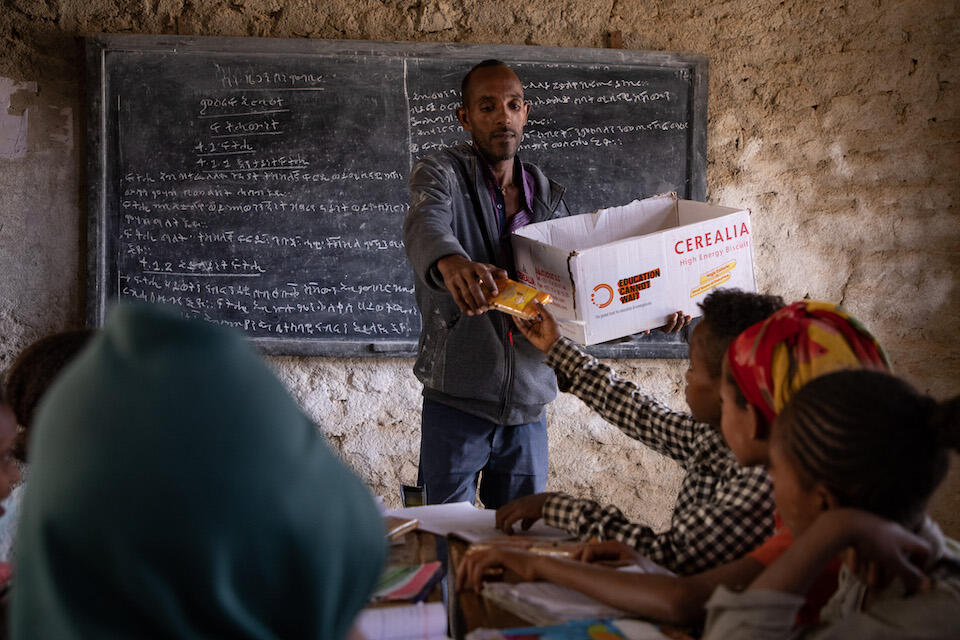 HIgh-energy biscuits are handed out to students at a school in Tigray, Ethiopia. 