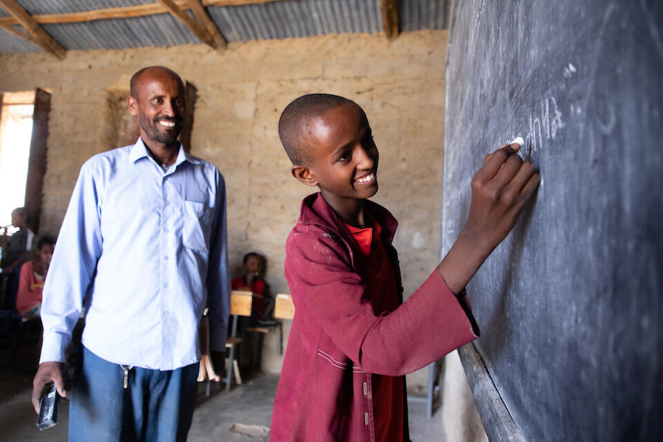 Fourteen-year-old Mellion writes on the board during class in Tigray, Ethiopia.