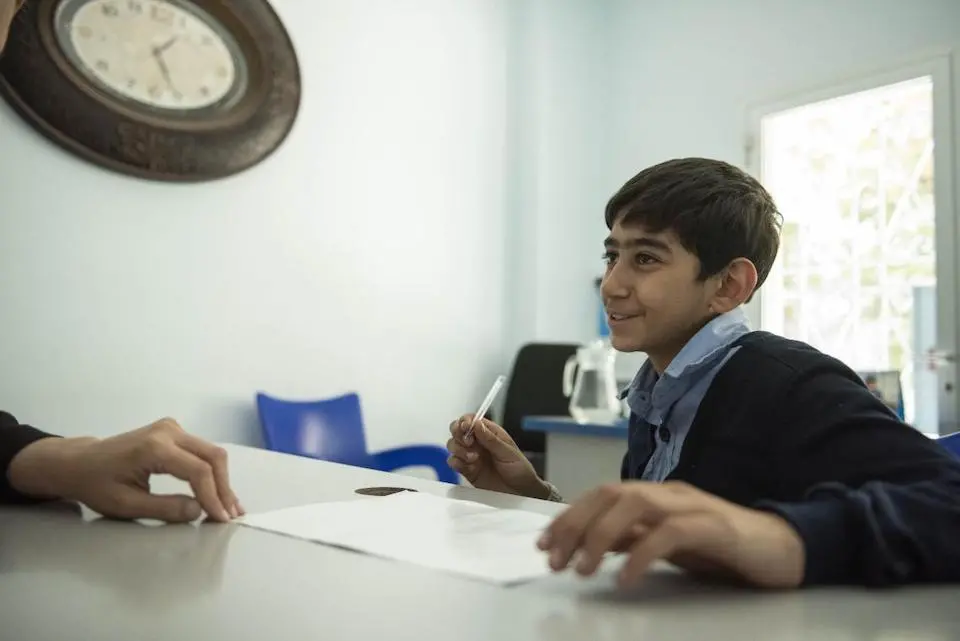 Osama, 14, during an individual psychosocial support session with his dedicated case manager, Salwa, at a UNICEF-supported centrer in Altal city, Rural Damascus, Syria.