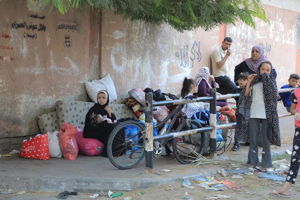 On Oct. 16, 2023, a family evacuates their home in northern Gaza ahead of an anticipated full-scale ground assault.