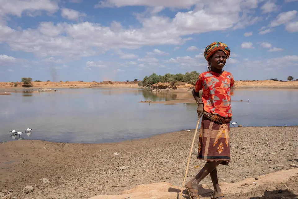 10-year-old Bukhari stands by his family's only source of water, some distance from home in Beda’as kebele, Shebele zone, Somali region, Ethiopia.