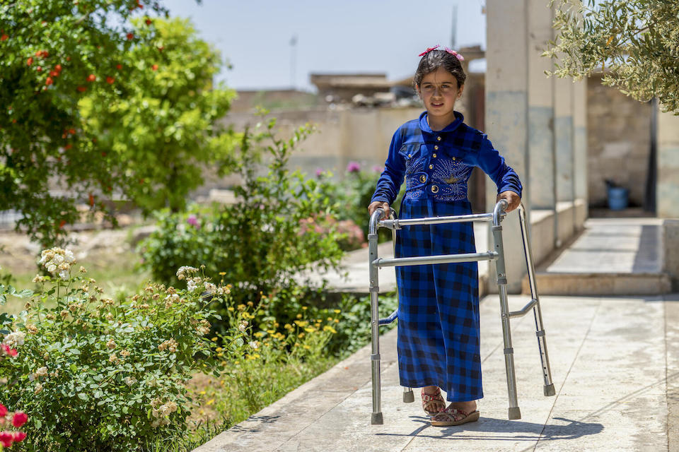 Fatima, 8, and her family receive support from UNICEF in the form of cash assistance, which helps cover the cost of basic needs and ensure Fatima, who suffers from muscular atrophy, can access essential support services.