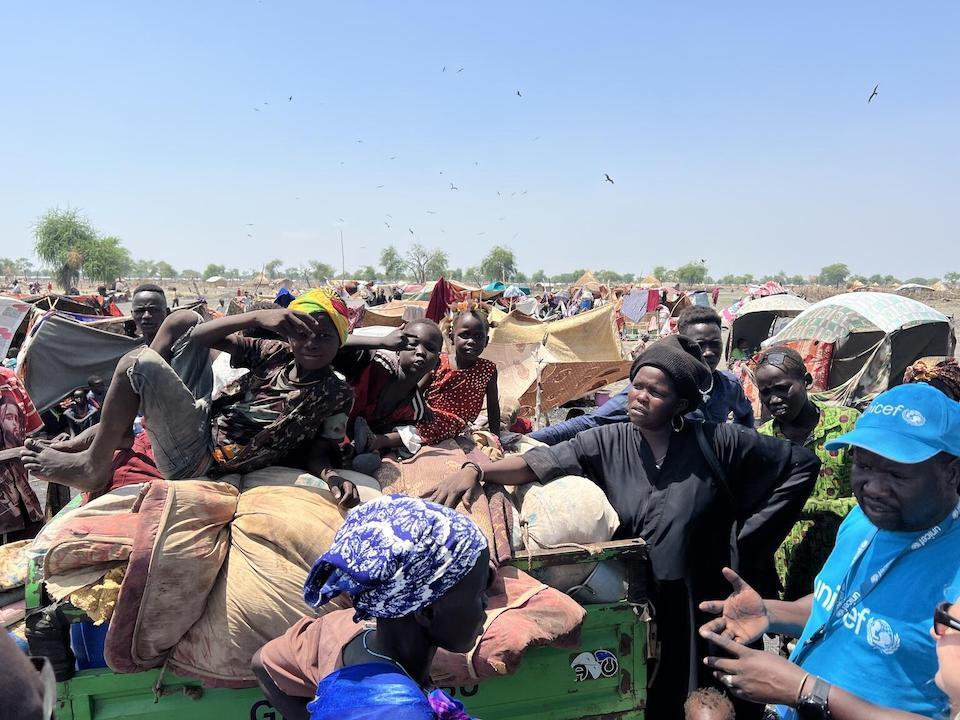 Children and mothers fleeing conflict in Sudan receive UNICEF assistance at a transit point in Roriak, Unity State, South Sudan.