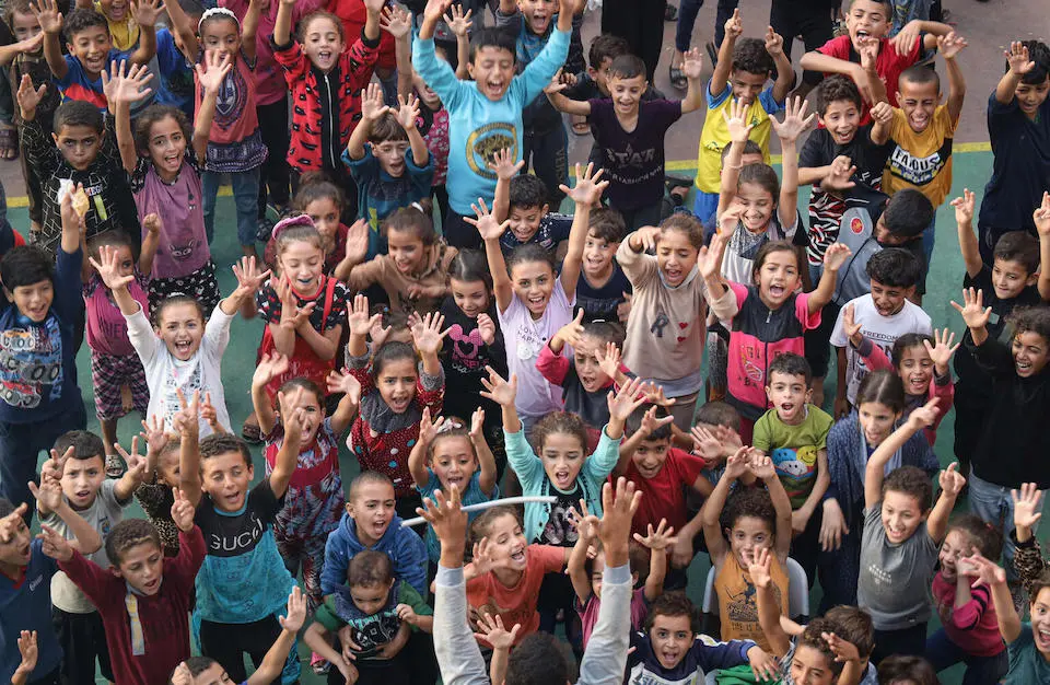 Children play during UNICEF-supported recreational activities in shelters for the displaced in Rafah City, southern Gaza Strip, amid continuous hostilities.