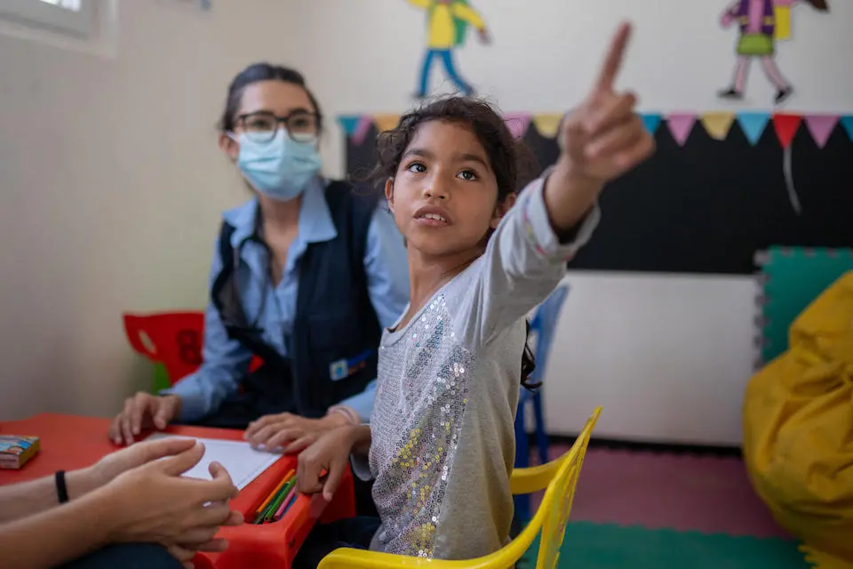 Angéla, 8, plays at a UNICEF child protection center on the Guatemalan border.