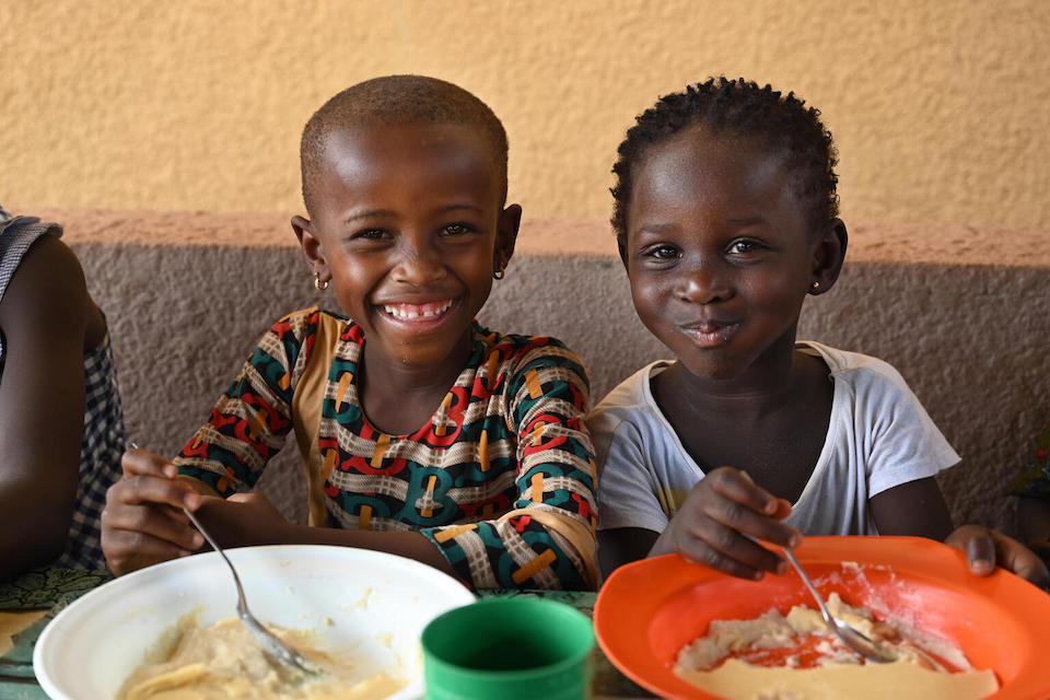 Children having a nutritious meal at the UNICEF-supported Pietro Bonili Health Center in Odienné, northwest Cote d’Ivoire.
