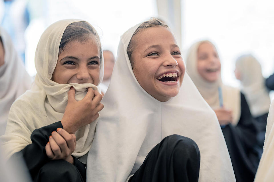 In September 2023, Maria, 8, (right) and a friend attend a UNICEF-supported Community-based Education Center in Bihsud District, Nangarhar Province, Afghanistan.