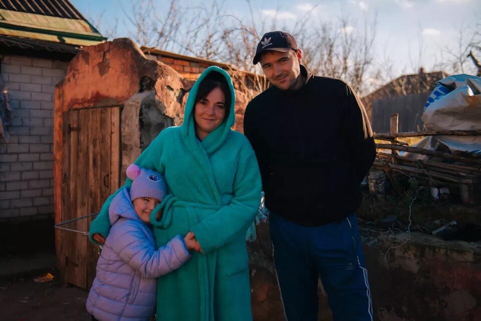 Oleksandr, his wife Yulia and their daughter Karolina, 5, at their home in Bezruky, a small village near Kharkiv, Ukraine. 