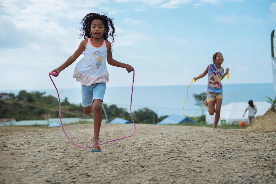 A girl jumps rope at a UNICEF-supported UNICEF-supported Child-Friendly Space next to the Portete shelter in Esmeraldas, Ecuador.