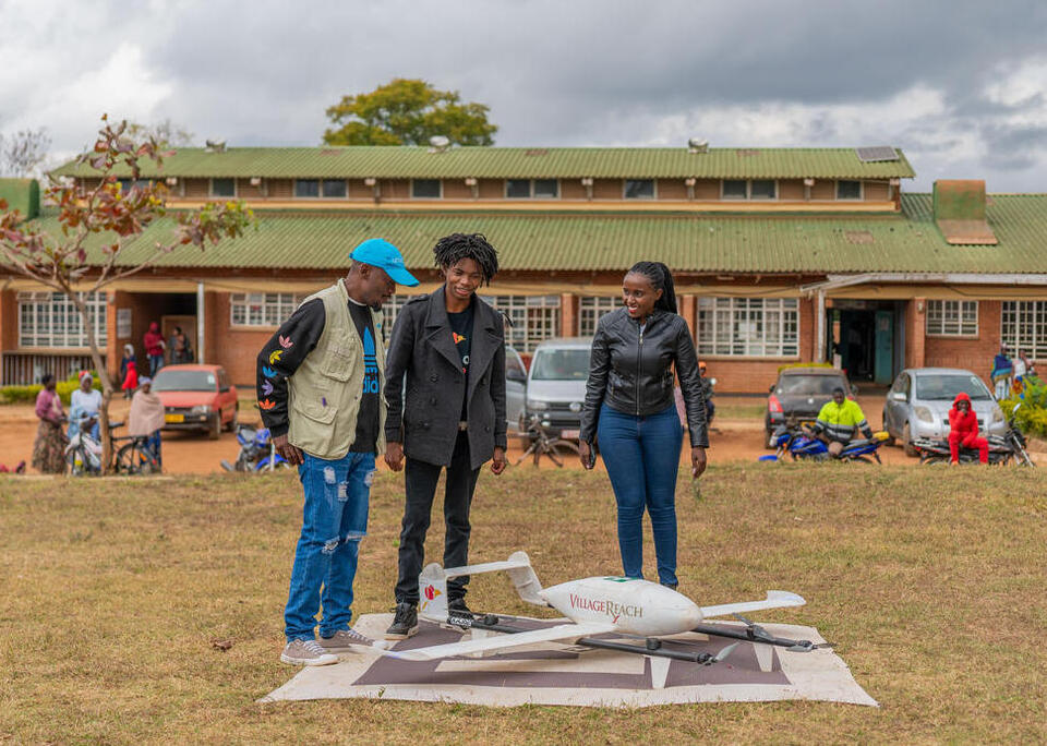 UNICEF and Swoop Aero staff check out a drone used to deliver polio vaccines to remote parts of Malawi in August 2023.