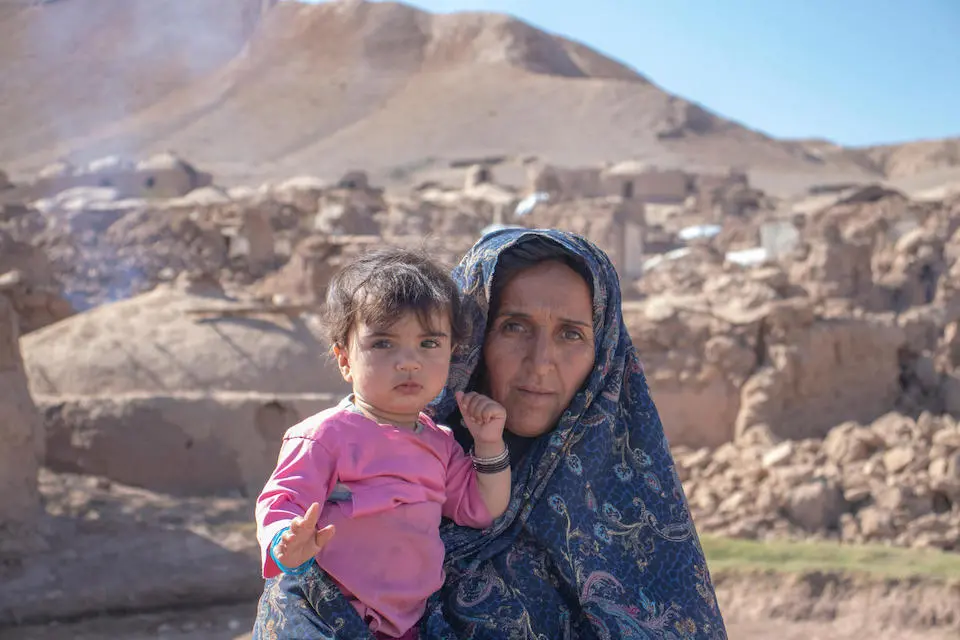 Nazook holds her 10-month-old baby girl, Fatima, in Ahmad Abad village in Herat province, western Afghanistan.