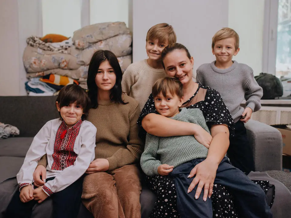 Svitlana and children in Odesa, Ukraine. The children received warm winter clothing from UNICEF.