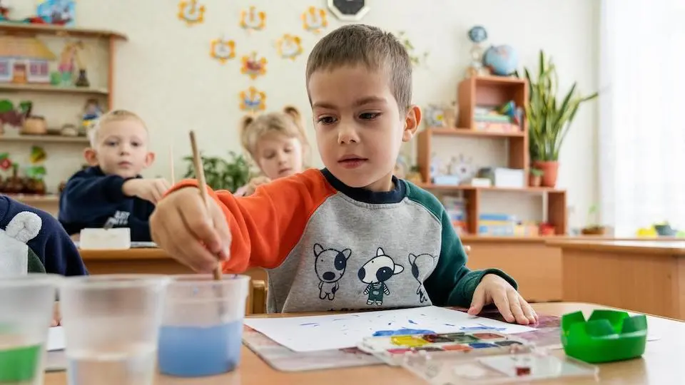 Children paint at school in Vasylkiv, Ukraine.