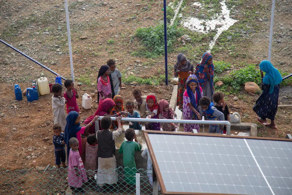 Children collect clean and safe water from a new solar-powered water station installed by UNICEF and partners in the small village of Gelhanty in Agig locality, Red Sea state, Sudan.