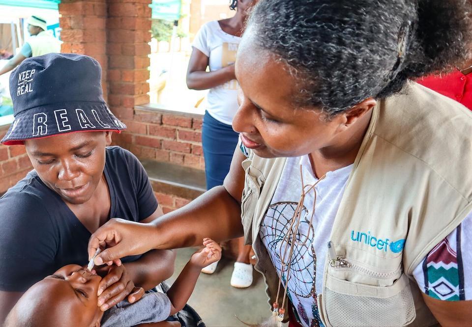 A child in Zambia receives the oral cholera vaccine provided by UNICEF.