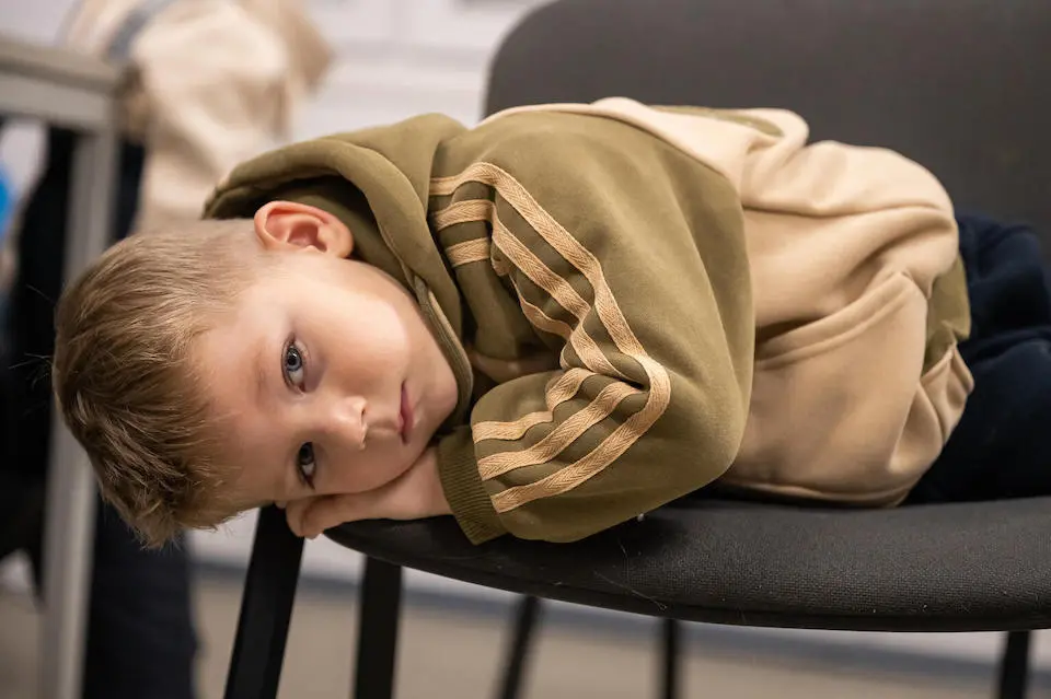 Four-year-old Mykyta lives with his mother and sisters in a modular village for IDPs in Pavlohrad, Ukraine. The war has displaced the family several times.