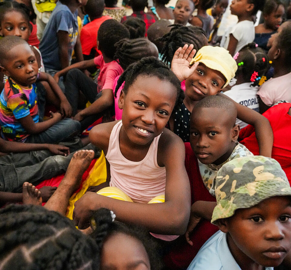 Children displaced by violence in Haiti's capital city Port-au-Prince wait to be screened for malnutrition at a UNICEF support site in Delmas.
