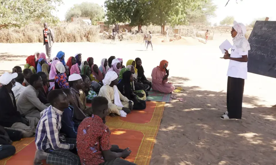 Sudanese refugee Mouwahib Mahamat Adam, 23, teaches literacy classes to local community members in Chad. 