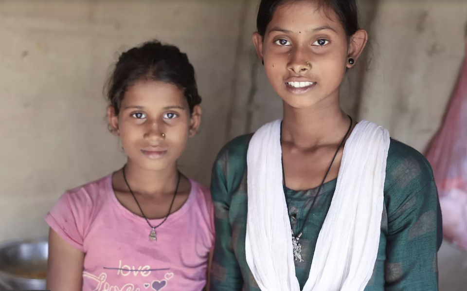 The UNICEF-supported Rupantaran program helped 16-year-old Antima (right, with one of her younger sisters) learn the skills she needed to open a small snack shop in Rautahat, Nepal.