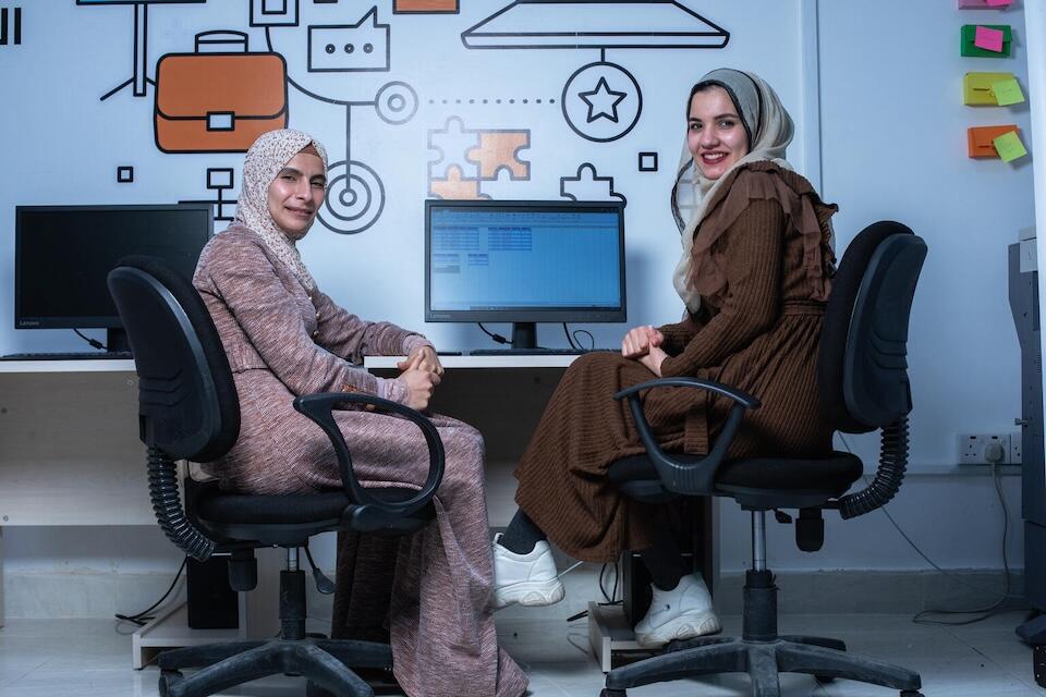 After graduating with a degree in law, Monia, 23, right, enrolled in UNICEF-supported digital skills training in Jordan as part of Skills4Girls.