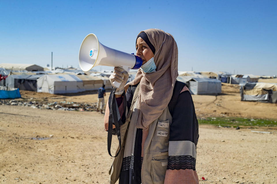 Malka, 34, a UNICEF-supported health worker in Alhol displacement camp, northeast Syria, works to raise awareness about the importance of vaccinations for children.