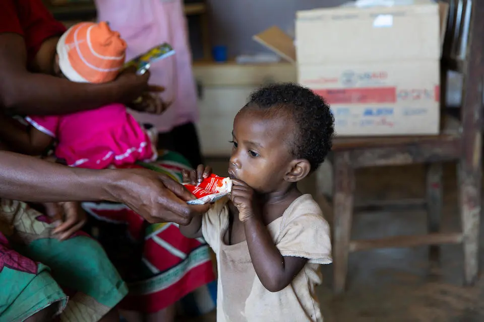 At a health center in southeastern Madagascar, a child is given Ready-to-Use Therapeutic Food supplied by UNICEF.