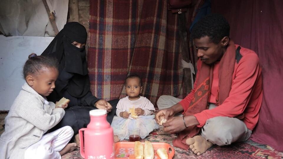 Yousra, 16, has lunch with her husband and their daughters at their home in Taizz, Yemen, before going to school on Jan. 31, 2024.