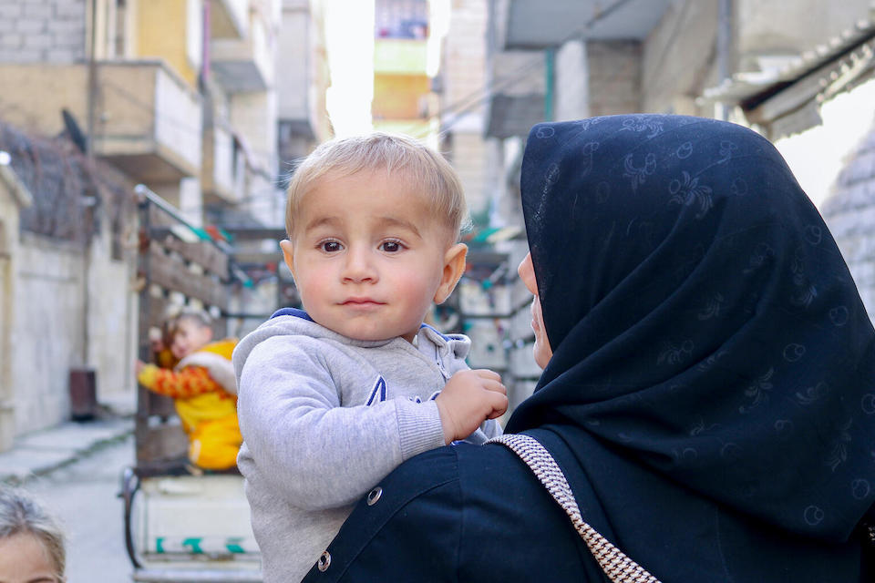Abd Alwahab, 3, and his mother Manal, outside a UNICEF-supported health and nutrition center in Nayrab, Aleppo city, Syria, on Feb. 12, 2024.