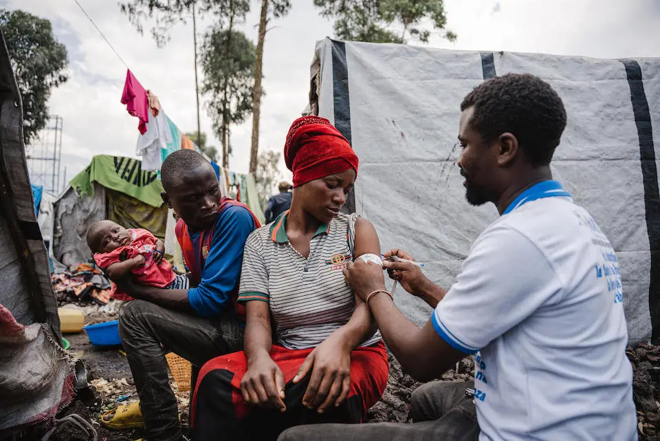 Aline, a nursing mother, gets screened for malnutrition during a malnutrition screening session organized by UNICEF at the Kanyaruchinya IDP site in North Kivu province, DRC, March 8, 2024.
