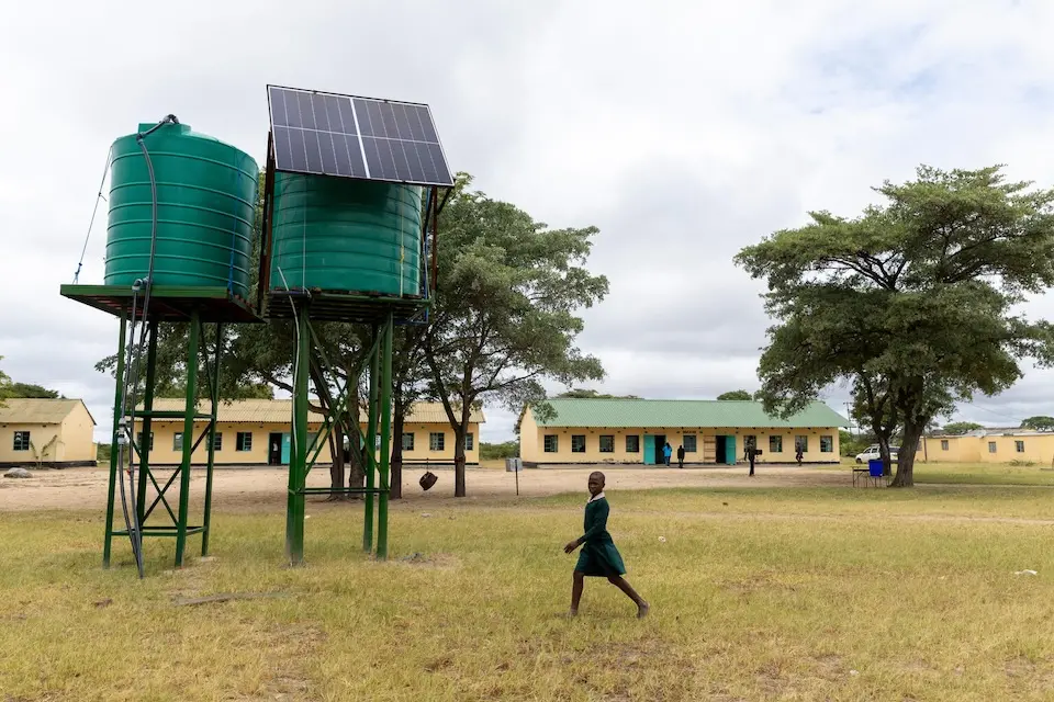 Water storage containers and solar panels installed by UNICEF and partners at the Mapengani primary school in Matebeleland South Province, Zimbabwe.