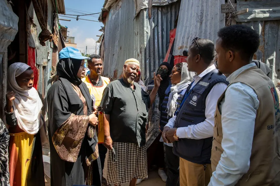 In Mogadishu, Somalia on March 4, 2024, a community leader, center, spoke with representatives from UNICEF, the Ministry of Health, Banadir Regional Administration (BRA) and WHO, who visited polio campaigns and went house-to-house in Dheriyaale Singaale IDP camp in the Hodan District, with health mobilizers to ensure children received the lifesaving polio vaccine.