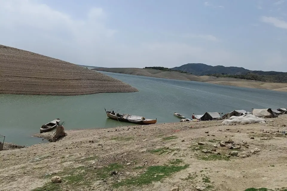 Fishing boats line the shore of Bharu Kot, a small island in the Haripur district, Khyber Pakhtunkhwa province of Pakistan.