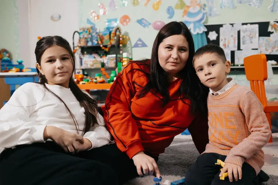 On Jan. 17, 2024, a family from Odesa, Ukraine, plays together at the play and learning hub set up by UNICEF in Balti, Moldova.
