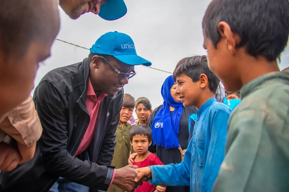 On May 17, 2024, Dr. Tajudeen Oyewale, UNICEF Representative in Afghanistan, meets with Shir Khan, who now lives in a tent with his family after his home was destroyed by recent flash floods in Baghlan-e-Jedid district, Baghlan province, northern Afghanistan.