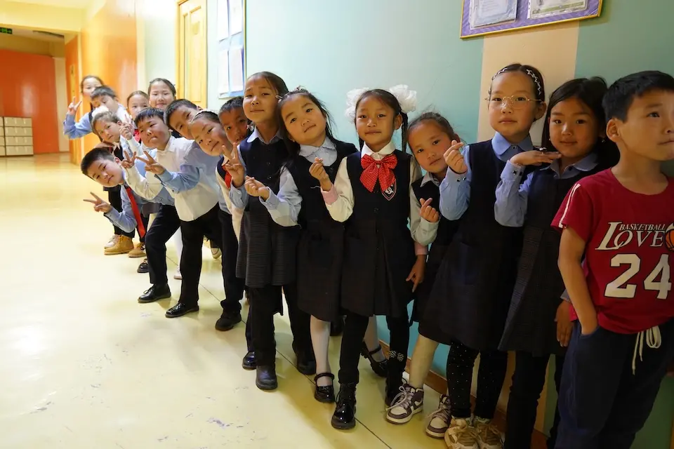 School children wait to be tested for strep throat as part of a UNICEF-supported initiative to do nationwide screenings and improve treatment protocols in the country.
