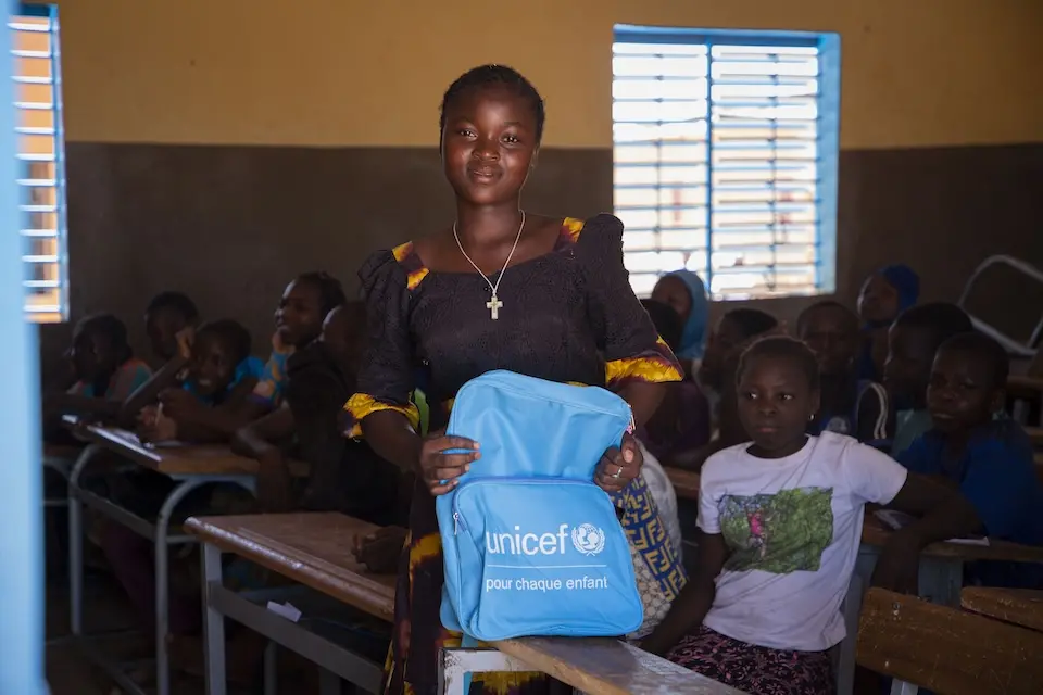 Fourteen-year-old Juliette receives a school kit from UNICEF in Kaya, Centre Nord Region, Burkina Faso.