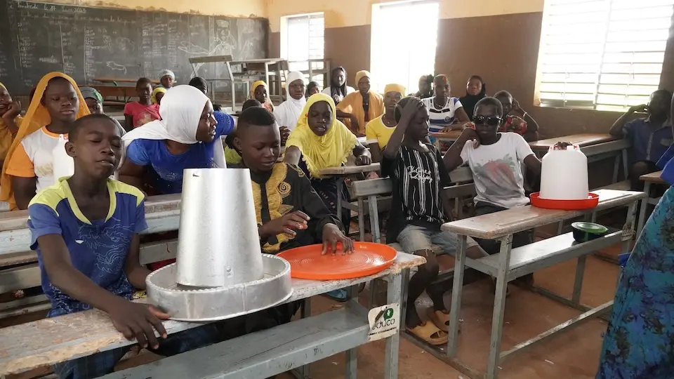 Children in Burkina Faso take a poultry farming course funded by Education Cannot Wait.