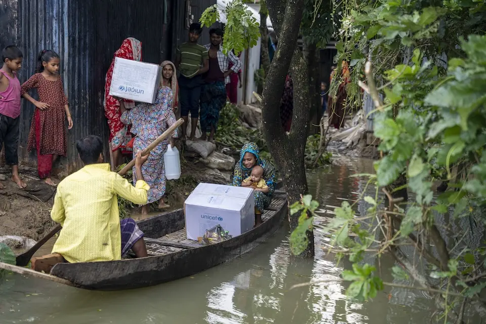 Children and families impacted by flooding in North-East Bangladesh receive emergency supplies from UNICEF.