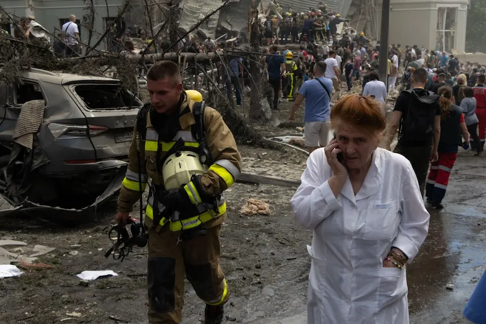 On July 8, 2024 in Kyiv, rescuers, hospital staff and volunteers clear rubble and search for people trapped under debris after an attack that hit Okhmatdyt Hospital, Ukraine's largest children's medical center.