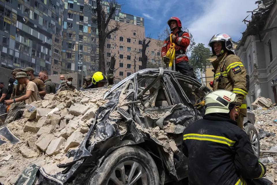On July 8, 2024 in Kyiv, rescuers, hospital staff and volunteers clear rubble and search for people trapped under debris after an attack that hit Okhmatdyt Hospital, Ukraine's largest children's medical center.