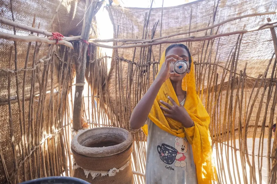 Twelve-year-old Shaimaa drinks clean and safe water from a UNICEF-supported water plant in Kassala state, Sudan.