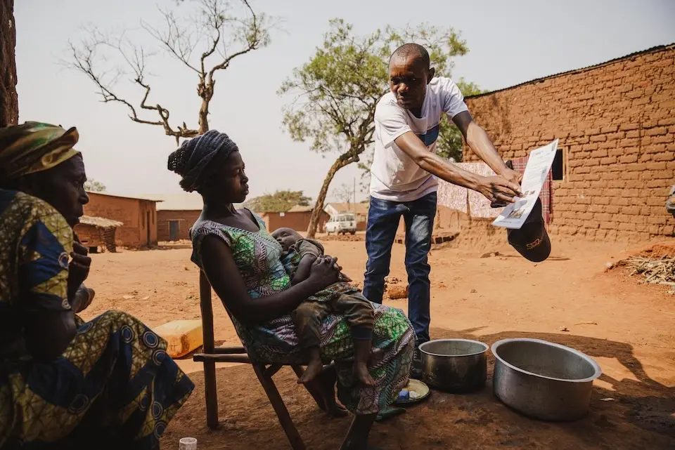 Gabriel Kahinga, a UNICEF-supported community outreach worker, goes door to door to raise awareness among families about mpox in Kamanyola, South Kivu province, DR Congo, on July 25, 2024.